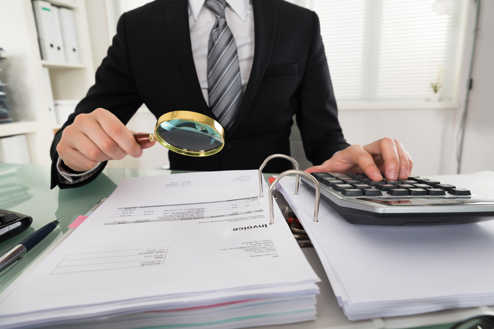 A CPA examining business expenses to identify write offs.